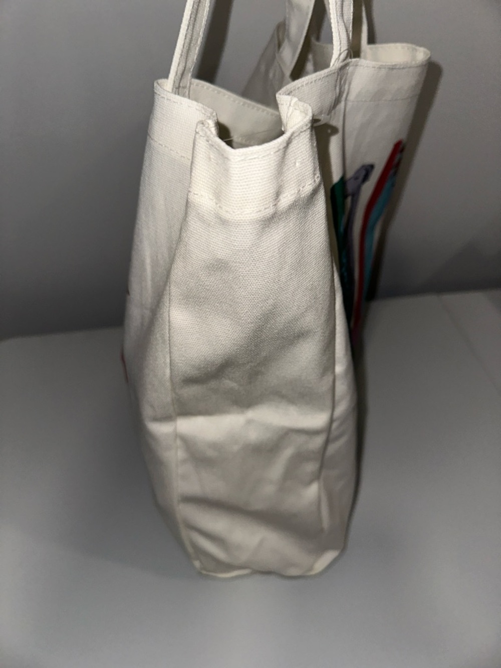 kate spade Ivory Multi Bookshelf Dog Figurine Canvas Tote Bag - Picture 7 of 9